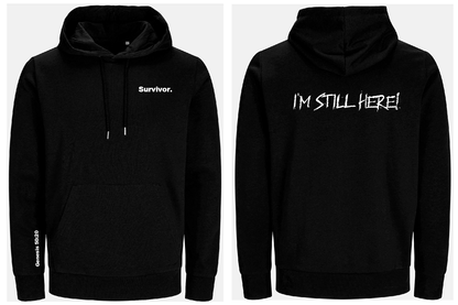 Black hoodie with 'Survivor.' and 'I'M STILL HERE!' text on a white background